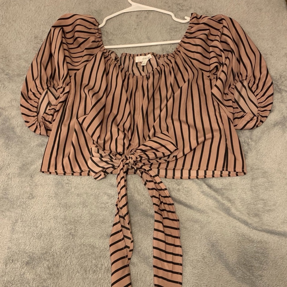 Nude and black tie shirt